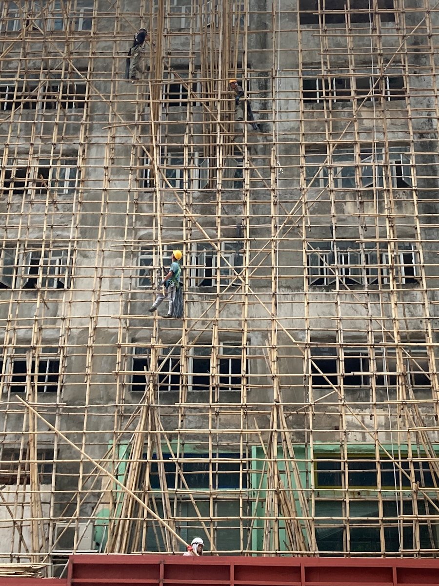 people walking on sidewalk near building during daytime